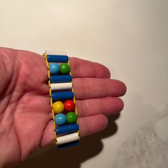 Elastic wooden tatiri watch for kids.  Helps teach kids how to read time. - Picture 5 of 8